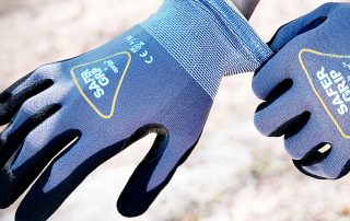 Two hands wearing Safer Grip by OPNBar nitrile coated gloves